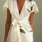 Elin | Elegancka sukienka kopertowa w kwiatowy wzór