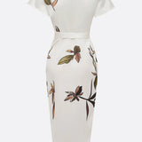 Elin | Elegancka sukienka kopertowa w kwiatowy wzór